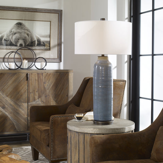 Vicente Slate Blue Table Lamp by Uttermost in blue. Made from steel, ceramic, fabric in a modern style.