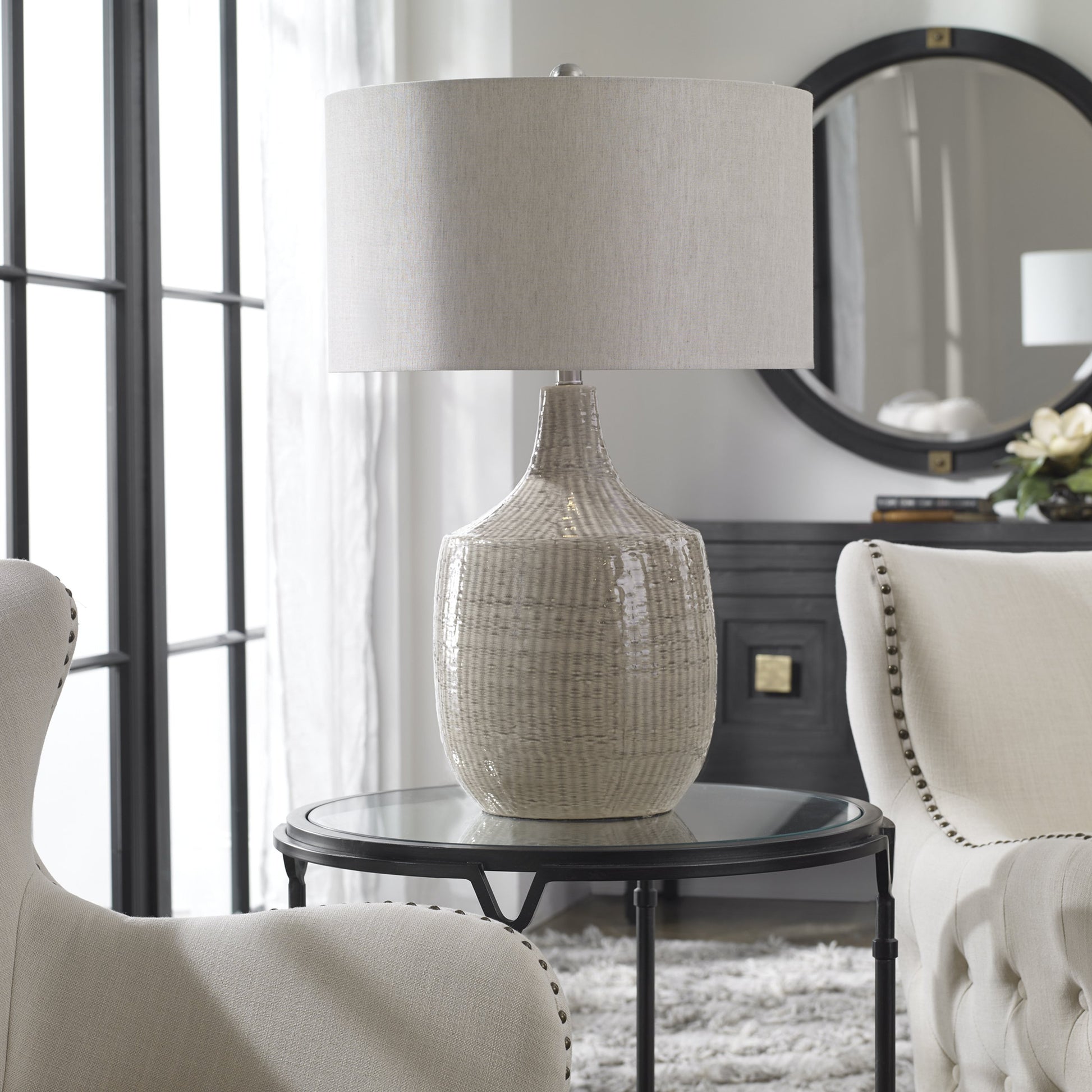 Felipe Table Lamp by Uttermost in light gray. Made from ceramic, iron, fabric in a eclectic & global style.