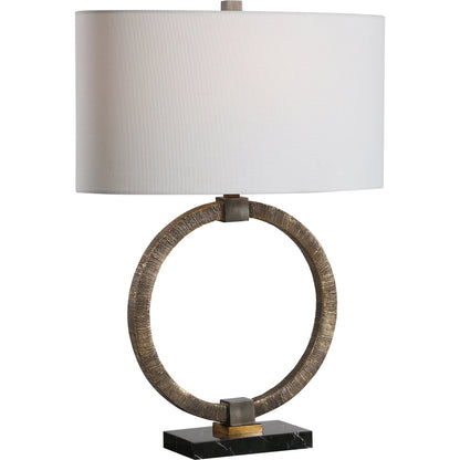 Relic Aged Table Lamp by Uttermost in gold. Made from resin, marble, iron, fabric in a eclectic & global style.