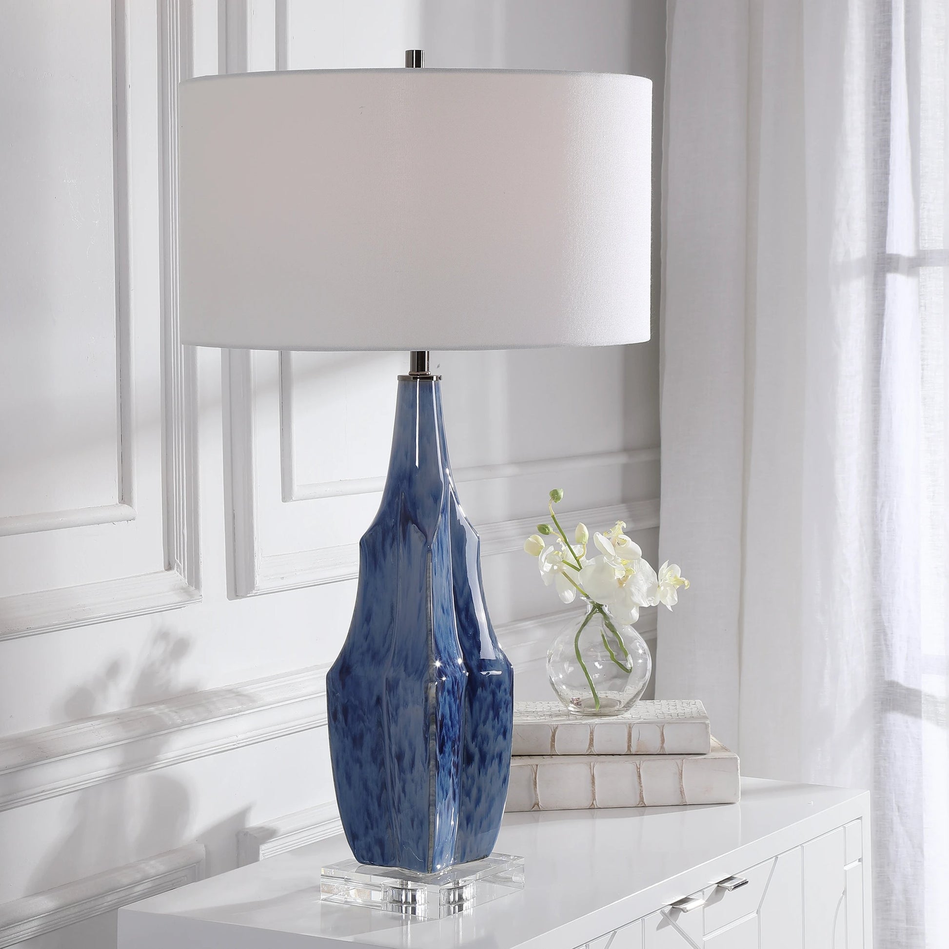 Everard Table Lamp by Uttermost in blue. Made from porcelain, crystal, iron, fabric in a modern style.