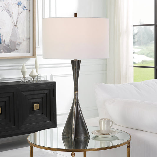 Keiron Table Lamp by Uttermost in brass. Made from steel, cast iron, fabric in a modern style.