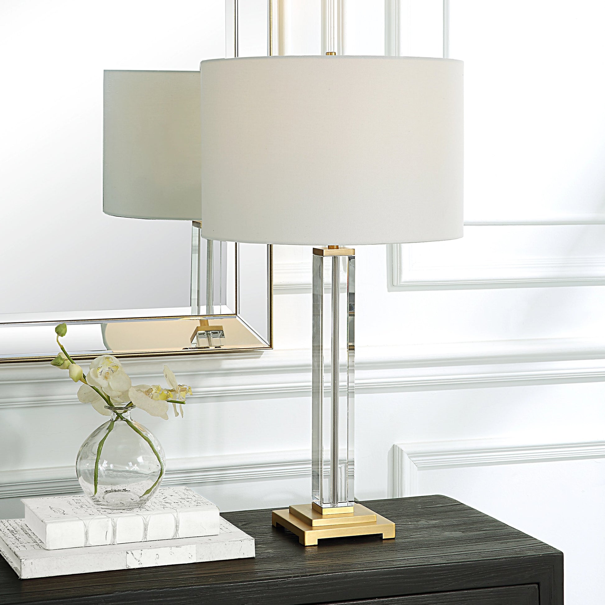 Crystal Column Table Lamp by Uttermost in brass. Made from crystal, iron, fabric in a modern style.