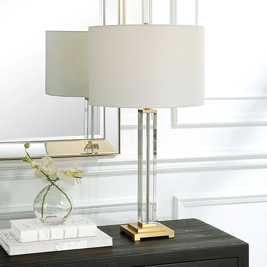 Crystal Column Table Lamp by Uttermost in brass. Made from crystal, iron, fabric in a modern style.