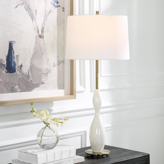 Annora Glossy Table Lamp by Uttermost in brass. Made from steel, resin, fabric in a modern style.