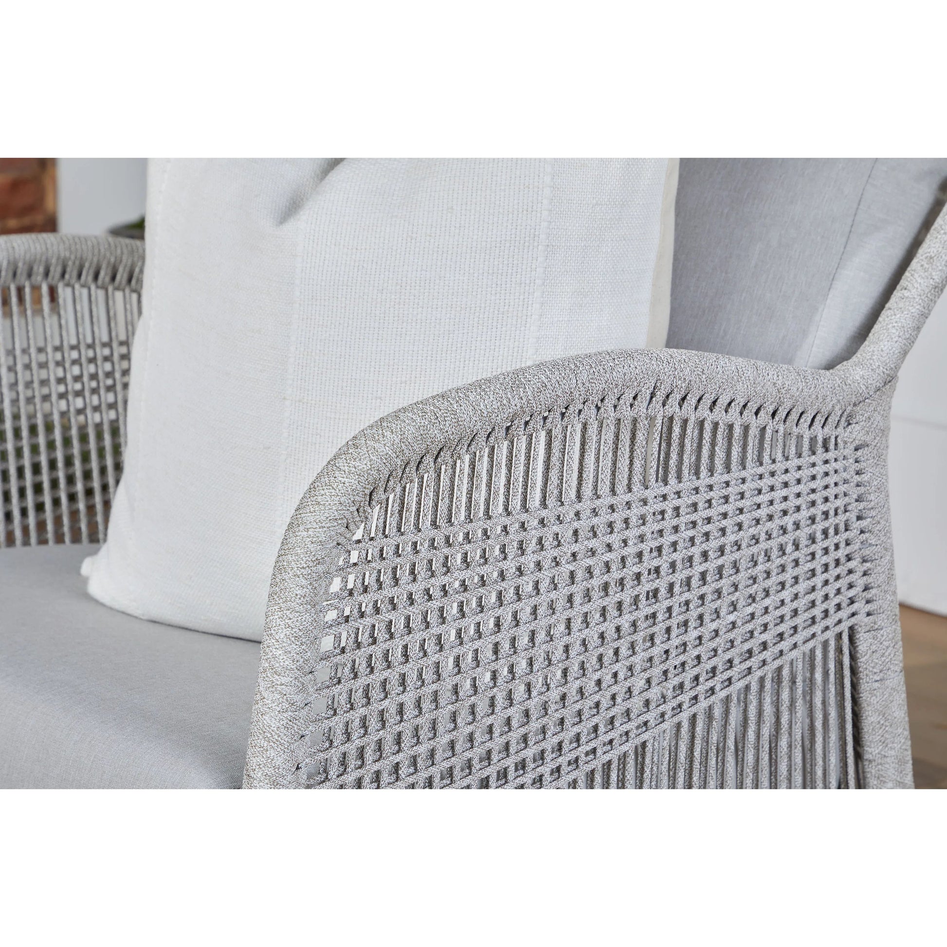 Loom Club Chair by Essentials For Living in gray teak, taupe, white flat rope, performance pumice. Made from solid teak wood, aluminum, 100% polyolefin rope, 100% olefin fabric, foam in a coastal style.