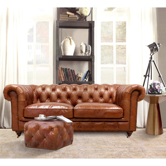 Chester Bay Loveseat by Pasargad Home in brown. Made from leather in a traditional style.