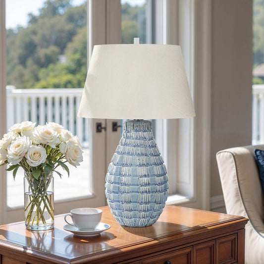 Winward Lamp by Bradburn Home in blue. Made from ceramic in a unique style.