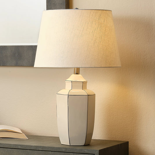 Outline Table Lamp by The Livingston Collection in white. Made from ceramic in a modern style.