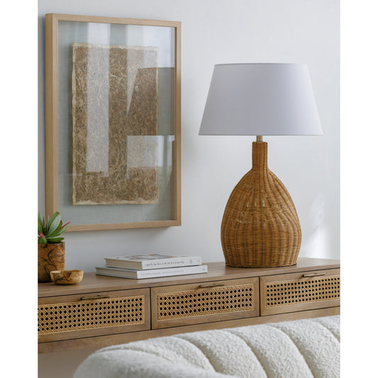 Lesi - 531337 by Surya in body: brown, shade: white, finial: metallic - brass, harp: metallic - brass, cord: translucent and natural, electroplated. Made from body: rattan, shade (outside): linen, shade (inside): metal, finial: