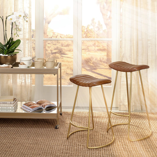 Luke Bar Stool by The Livingston Collection in buff leather, gold iron. Made from leather, iron in a modern style.