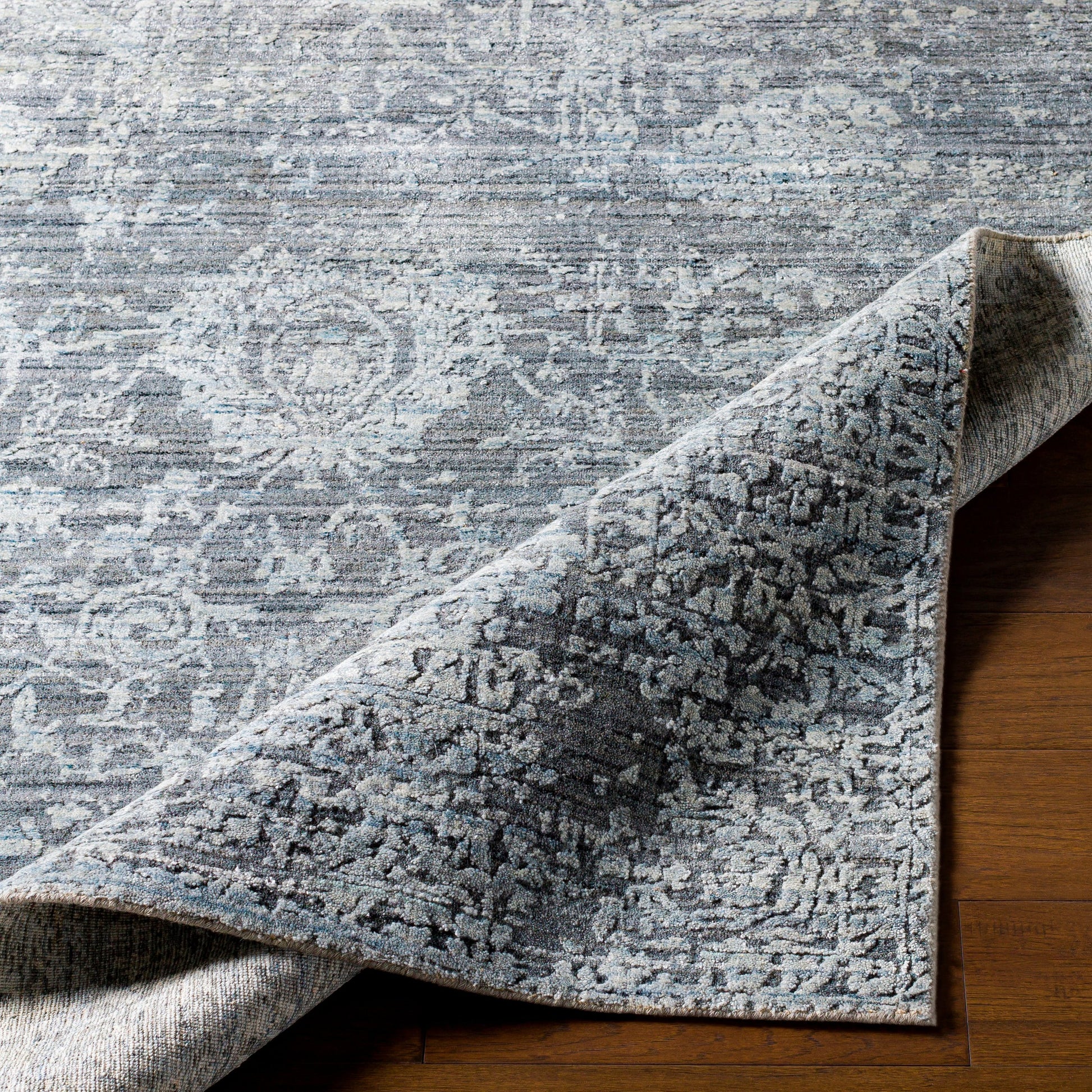 Lucknow Rug - 25225 by Surya in charcoal, light slate, black. Made from 75% viscose, 25% wool in a unique style.