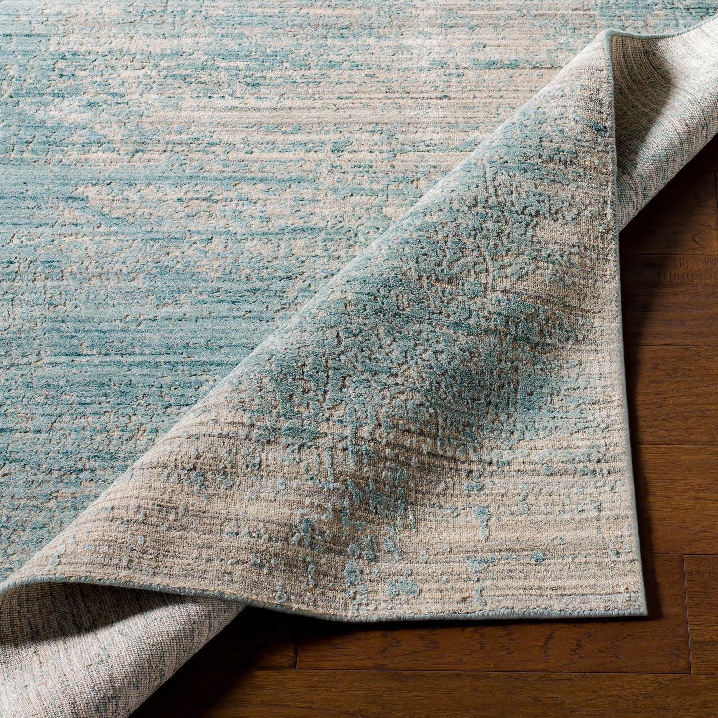 007 SI-1885459,SI-1885460,SI-1885461,SI-1885462,SI-1885463 | Closeup | Lucknow Rug - 26922 by Surya in medium gray, taupe, charcoal, slate, deep teal. Made from 75% viscose, 25% wool in a unique style.