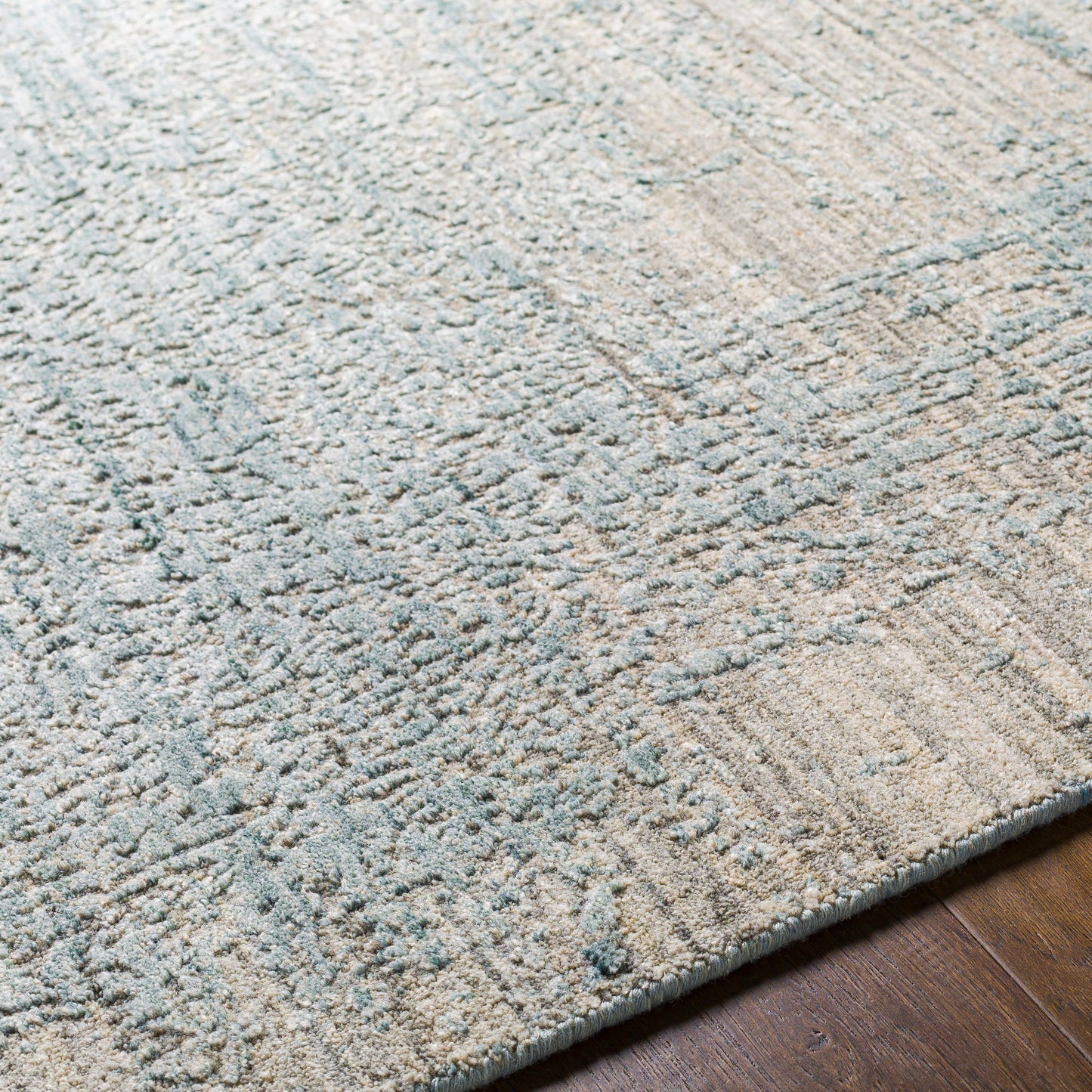 005 SI-1885459,SI-1885460,SI-1885461,SI-1885462,SI-1885463 | Closeup | Lucknow Rug - 26922 by Surya in medium gray, taupe, charcoal, slate, deep teal. Made from 75% viscose, 25% wool in a unique style.