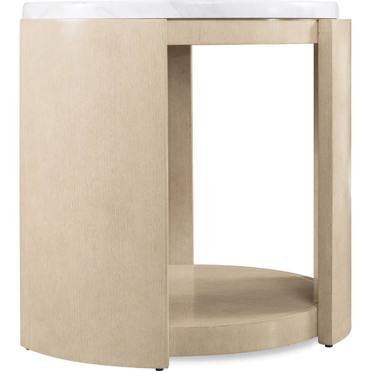 Westwood Round Side Table by Hooker Furniture in polished limestone, quartered oak veneers. Made from glass reinforced concrete, oak veneers, leather, brown leather exterior in a transitional style.
