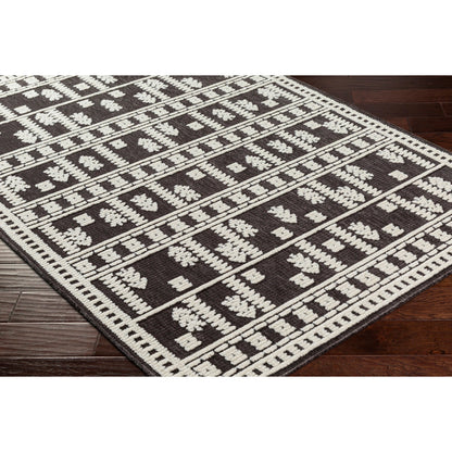Lyna Rug by Livabliss in black, off-white. Made from main: 70% polypropylene, main: 30% polyester in a eclectic & global style.