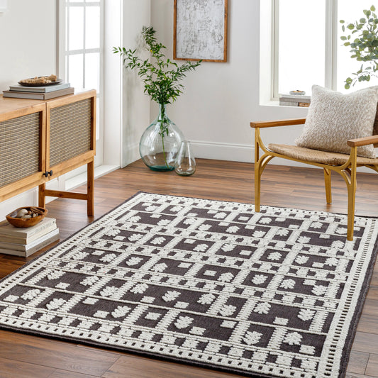 Lyna Rug by Livabliss in dark grey, charcoal. Made from main: 70% polypropylene, main: 30% polyester in a eclectic & global style.