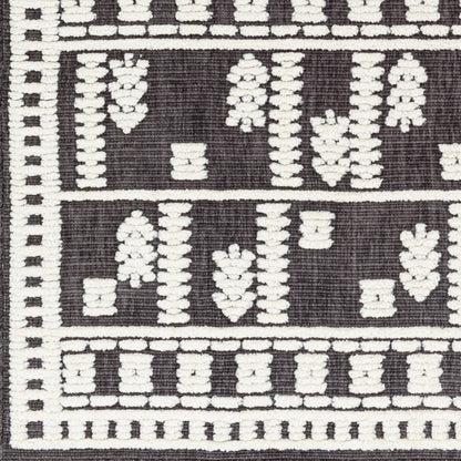 Lyna Rug by Livabliss in black, off-white. Made from main: 70% polypropylene, main: 30% polyester in a eclectic & global style.