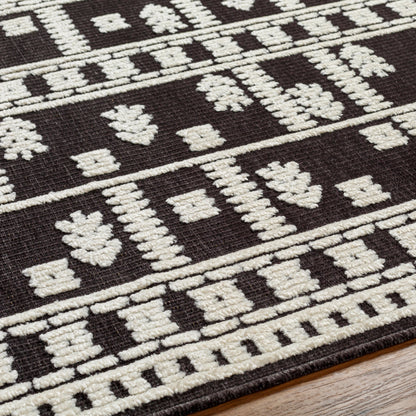 Lyna Rug by Livabliss in black, off-white. Made from main: 70% polypropylene, main: 30% polyester in a eclectic & global style.