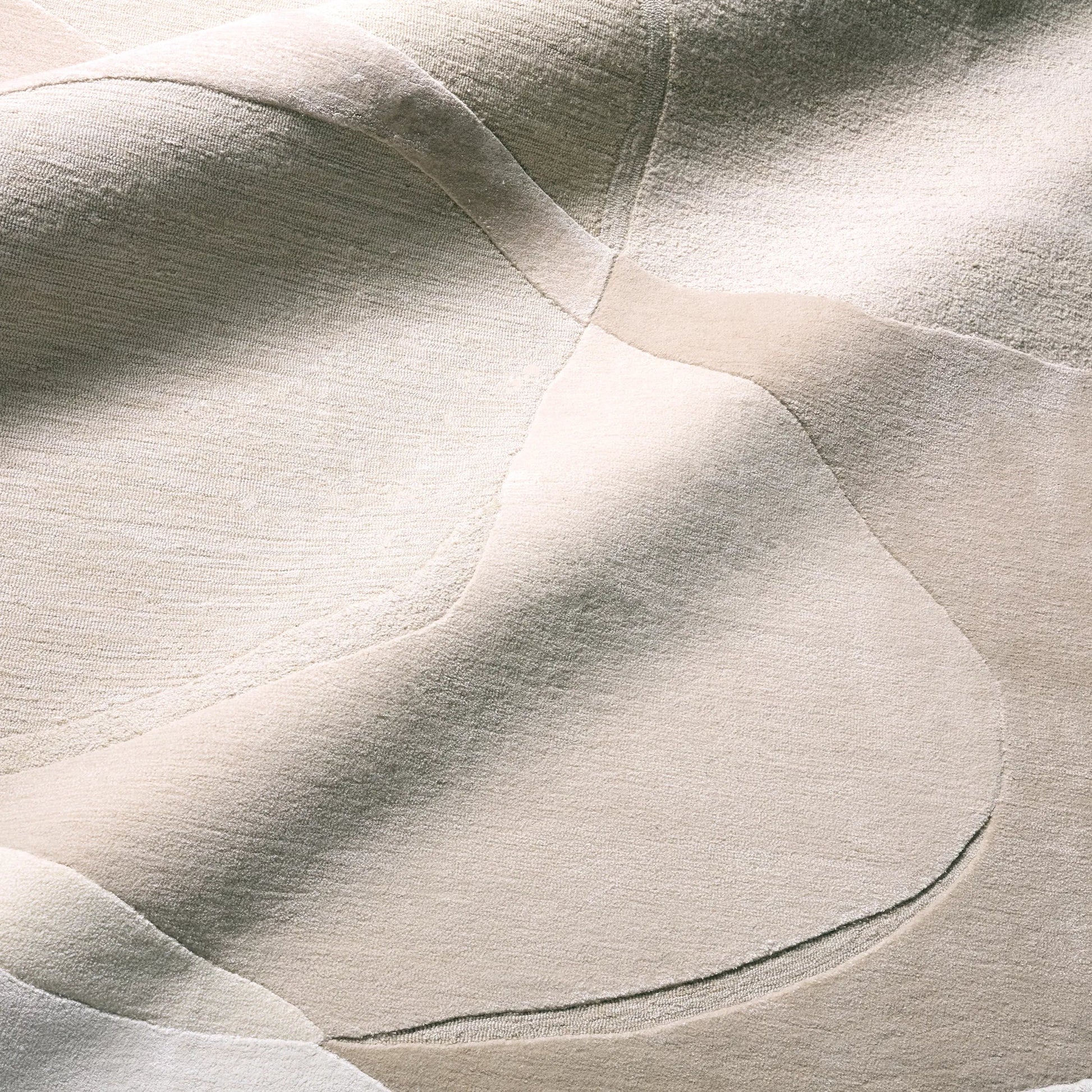 Layered Form​ LYD02 Rug by Jaipur Living in ivory, white, tan, beige. Made from 65% viscose 35% wool in a unique style.