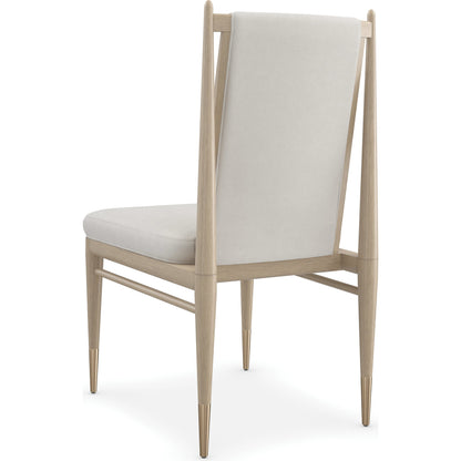 Unity Light Dining Chair by Caracole in ivory and sun drenched oak. Made from oak in a modern style.