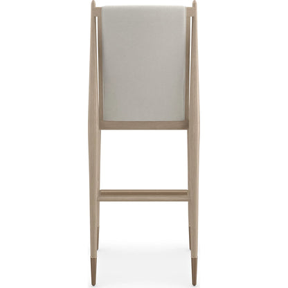Unity Light Bar Stool by Caracole. Made from oak in a unique style.