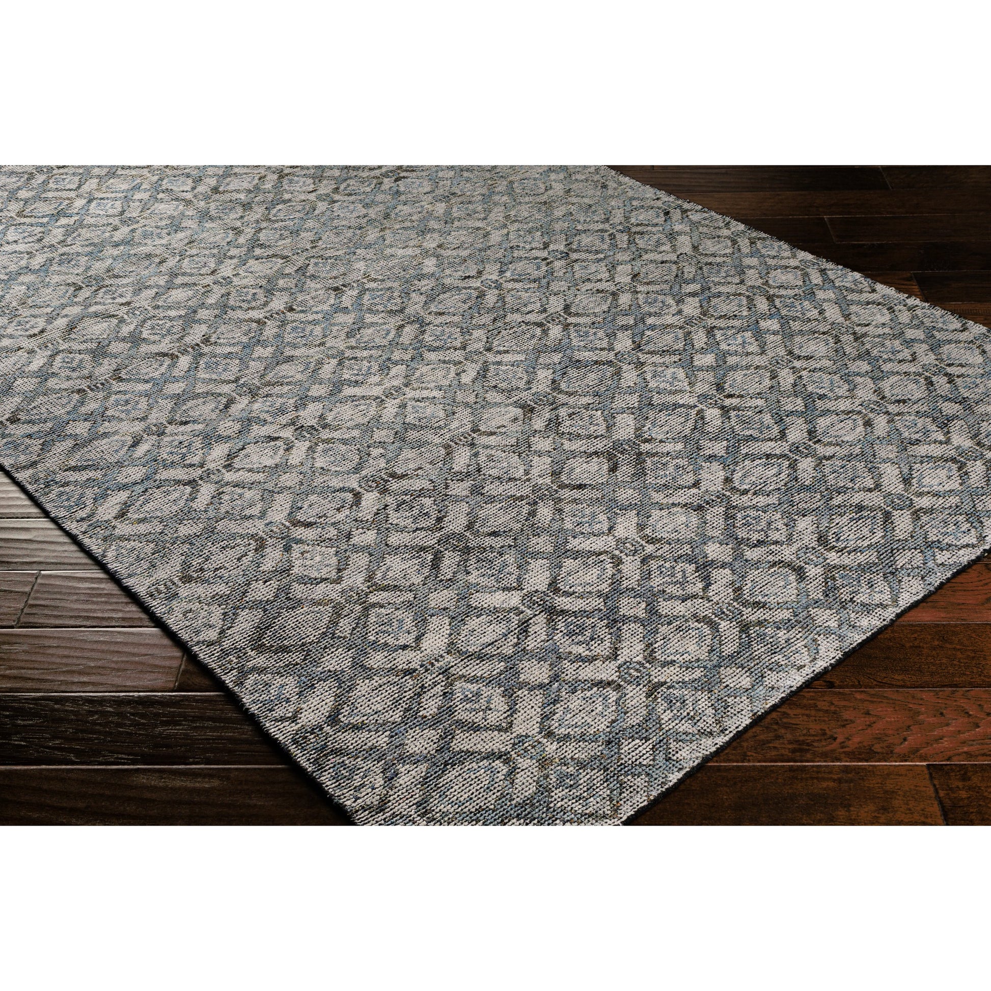 Malaga Rug by Surya in ink blue, denim, light sage, light olive, dark brown. Made from 90% wool, 10% polyester in a transitional style.