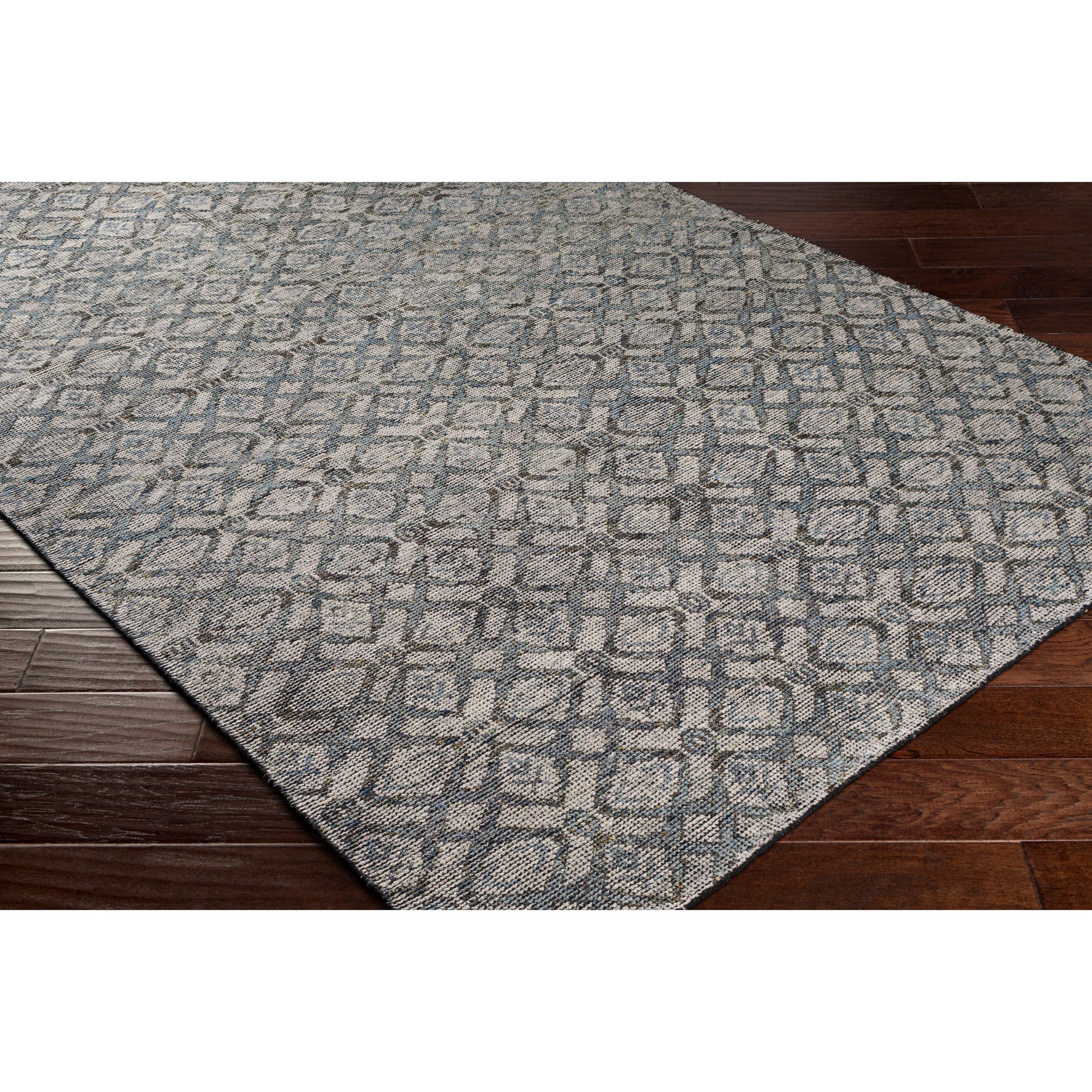 Malaga Rug by Surya in ink blue, denim, light sage, light olive, dark brown. Made from 90% wool, 10% polyester in a transitional style.