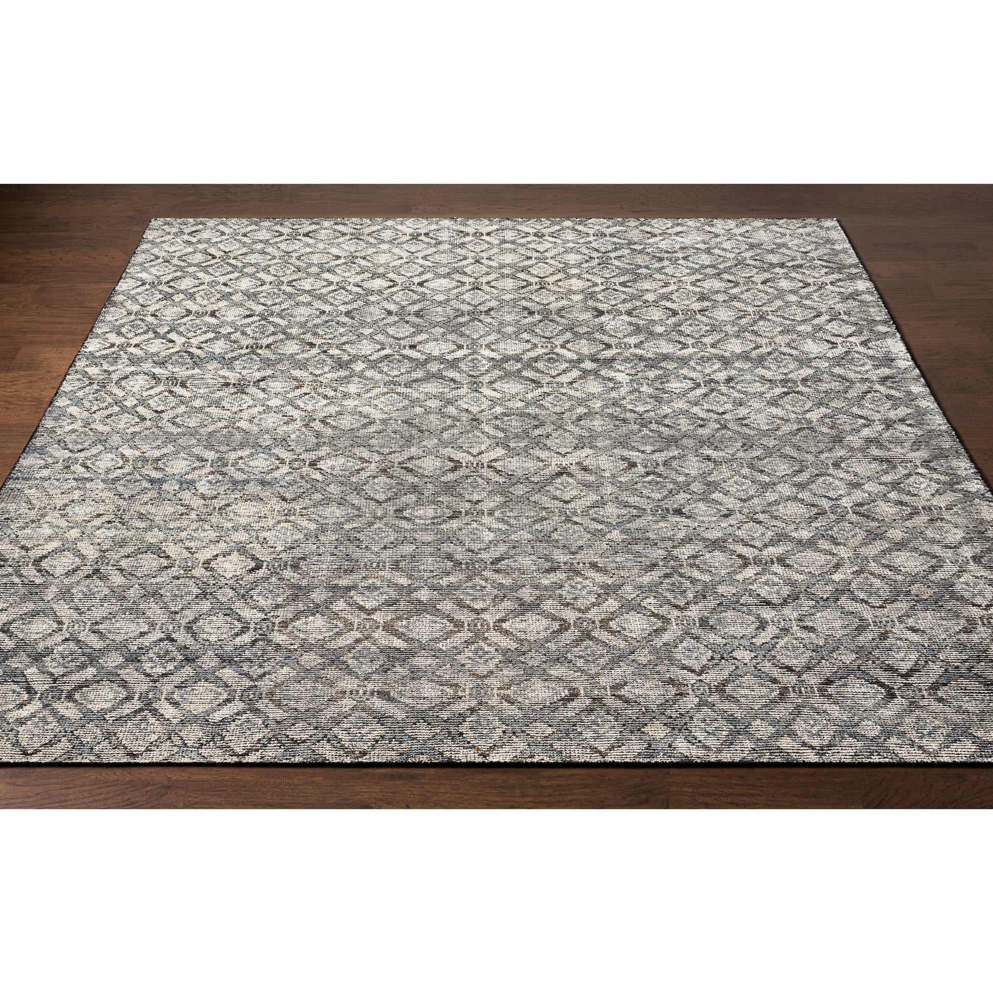 Malaga Rug by Surya in ink blue, denim, light sage, light olive, dark brown. Made from 90% wool, 10% polyester in a transitional style.