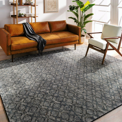 Malaga Rug by Surya in ink blue, denim, light sage, light olive, dark brown. Made from 90% wool, 10% polyester in a transitional style.
