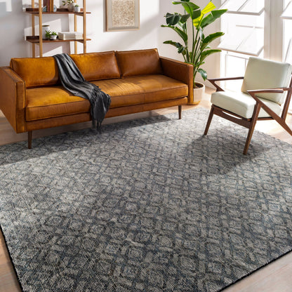 Malaga Rug by Surya in ink blue, denim, light sage, light olive, dark brown. Made from 90% wool, 10% polyester in a transitional style.
