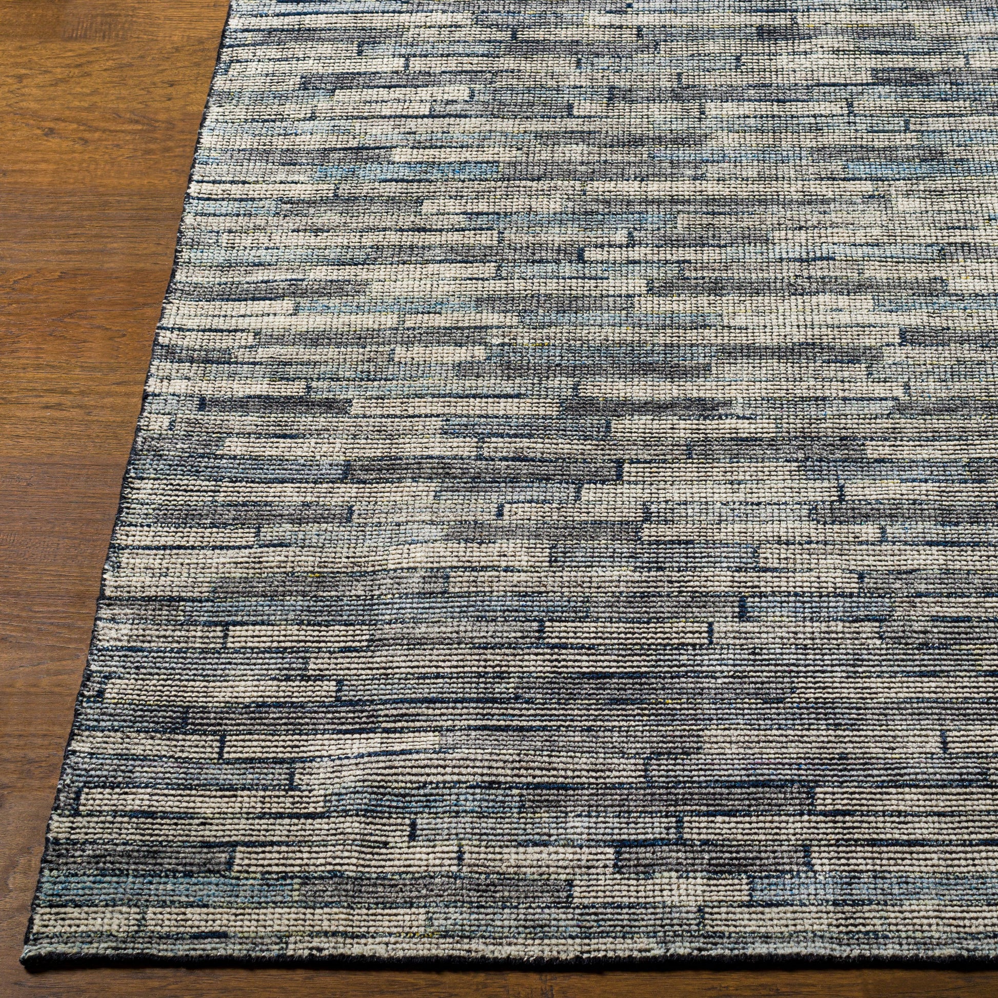 Malaga Rug - 26055 by Surya in ink blue, denim, light sage, light olive. Made from 90% wool, 10% polyester in a unique style.