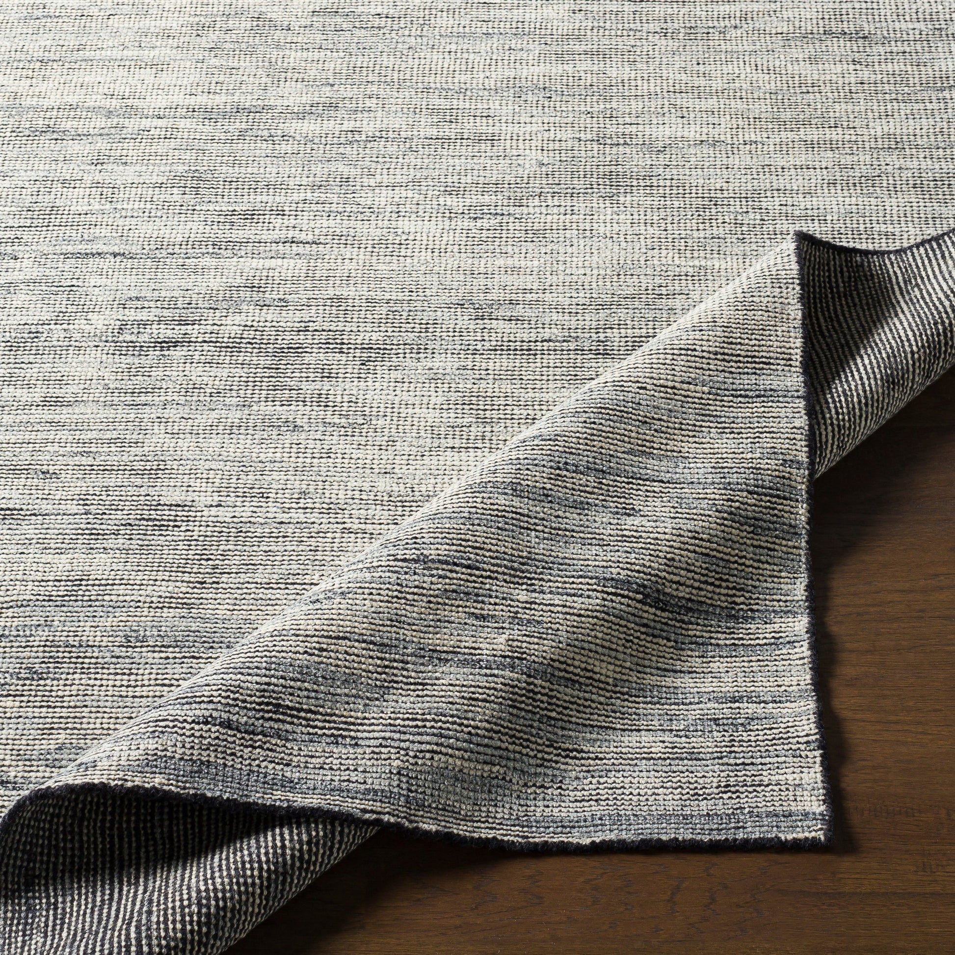 Malaga Rug - 26054 by Surya in ink blue, denim, light sage, light olive. Made from 90% wool, 10% polyester in a unique style.