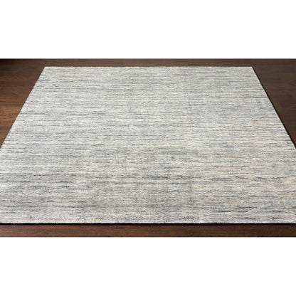 Malaga Rug - 26054 by Surya in ink blue, denim, light sage, light olive. Made from 90% wool, 10% polyester in a unique style.