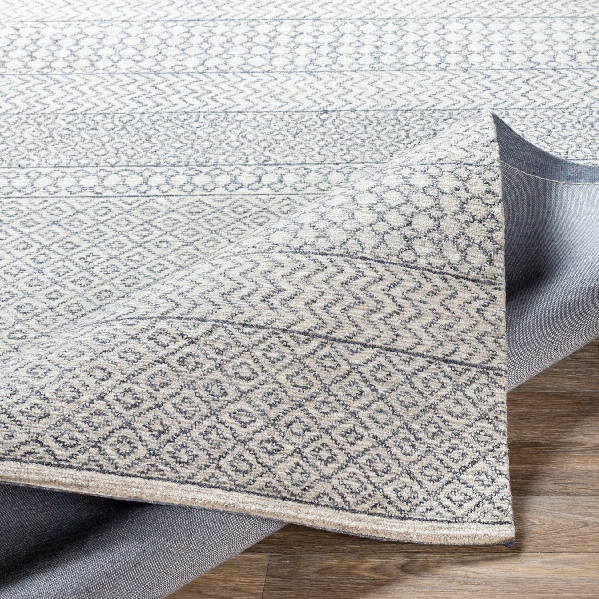 Maroc Rug by Livabliss in light beige, oatmeal, charcoal, black. Made from unique in