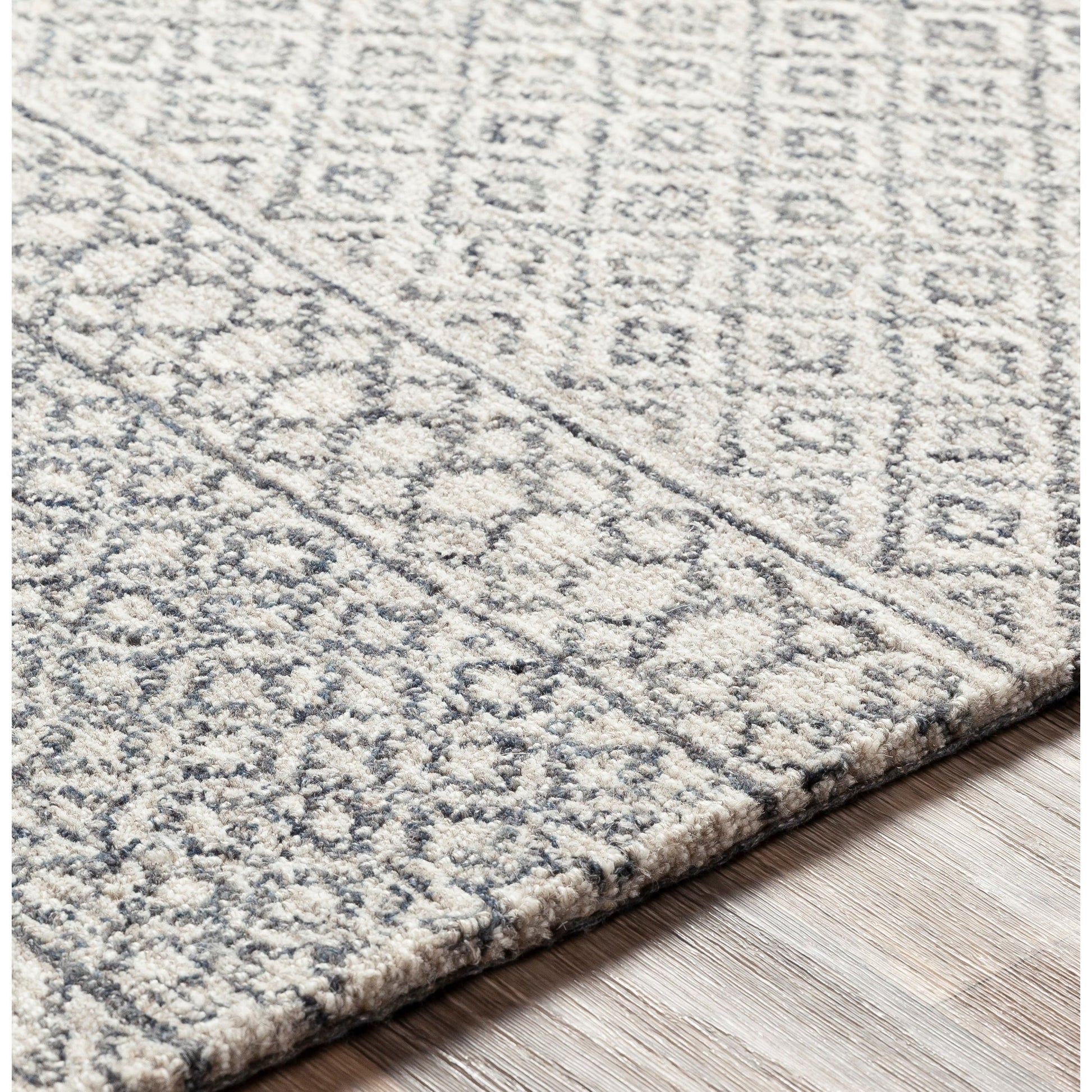 Maroc Rug by Livabliss in light beige, oatmeal, charcoal, black. Made from unique in