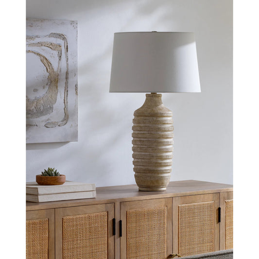Mindra Accent Table Lamp 531680 by Livabliss in body: brown; shade: white; finial: metallic - nickel; harp: metallic - nickel; cord: translucent and coloredplated. Made from resin, linen, polyester, iron in a unique style.