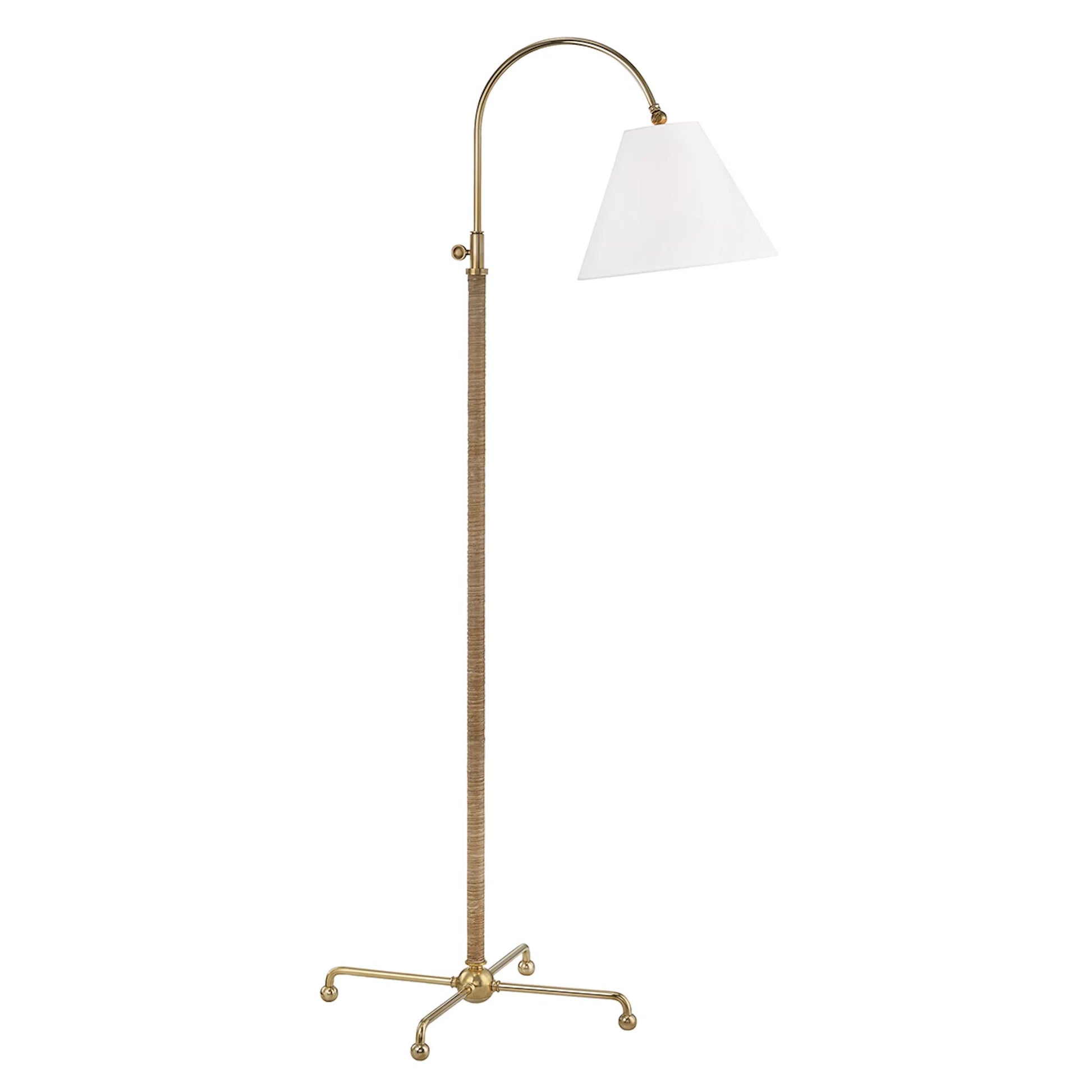Curves NO.1 Floor Lamp W/ Rattan Accent by Hudson Valley in aged brass. Made from steel in a traditional style.