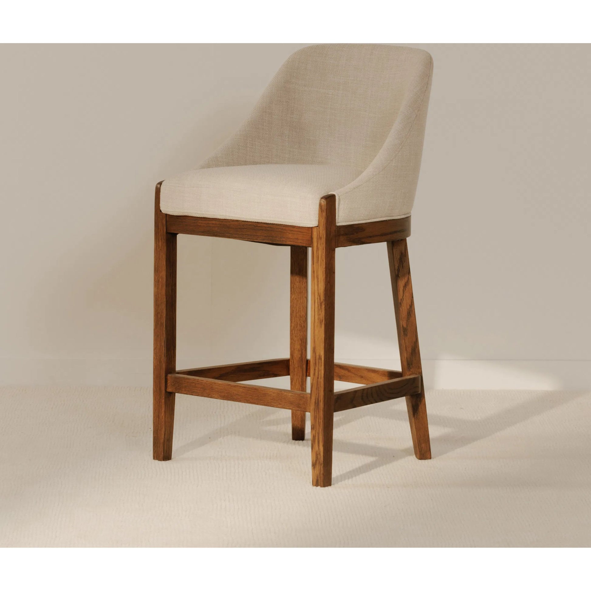 Edward Counter Stool by Moe's Home Collection in green and b23-1. Made from upholstery: 100% polyester, solid oak frame, plywood in a transitional style.