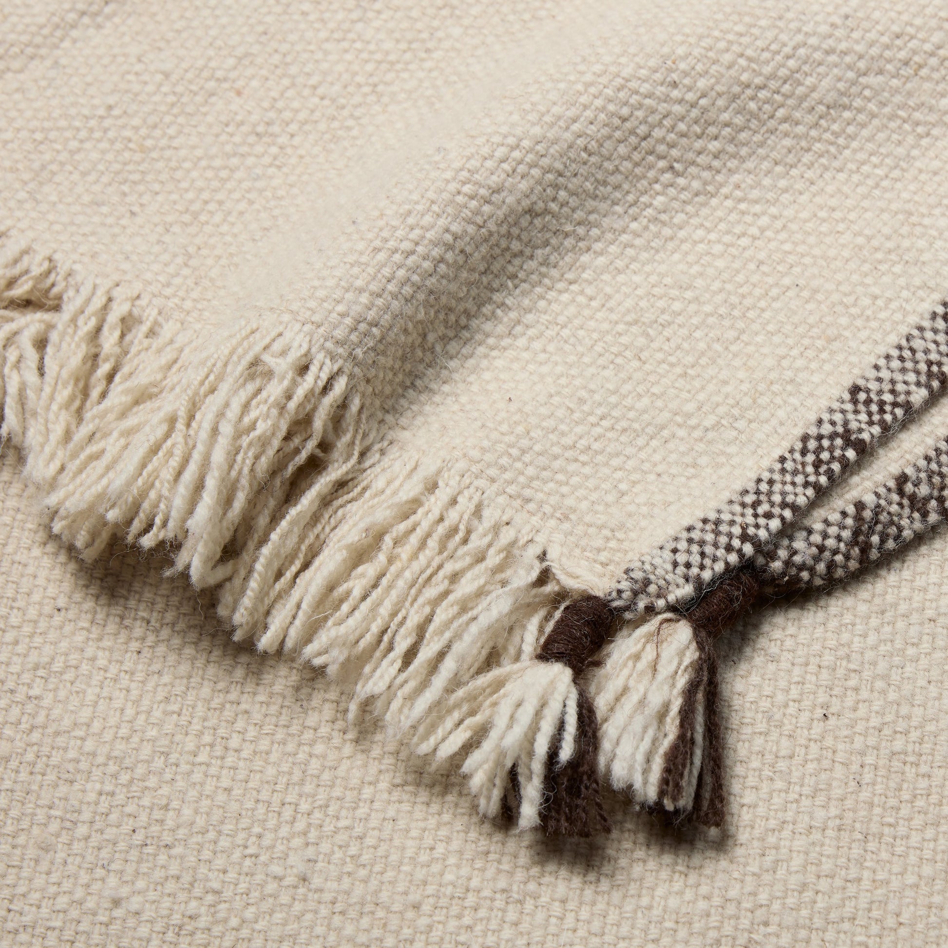 Margosa MGT06 Throw by Jaipur Living in cream, brown. Made from 100% wool in a modern style.