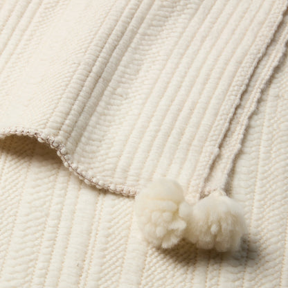 Margosa Irimen Throw by Jaipur Living in cream. Made from 80% wool 20% silk in a modern style.