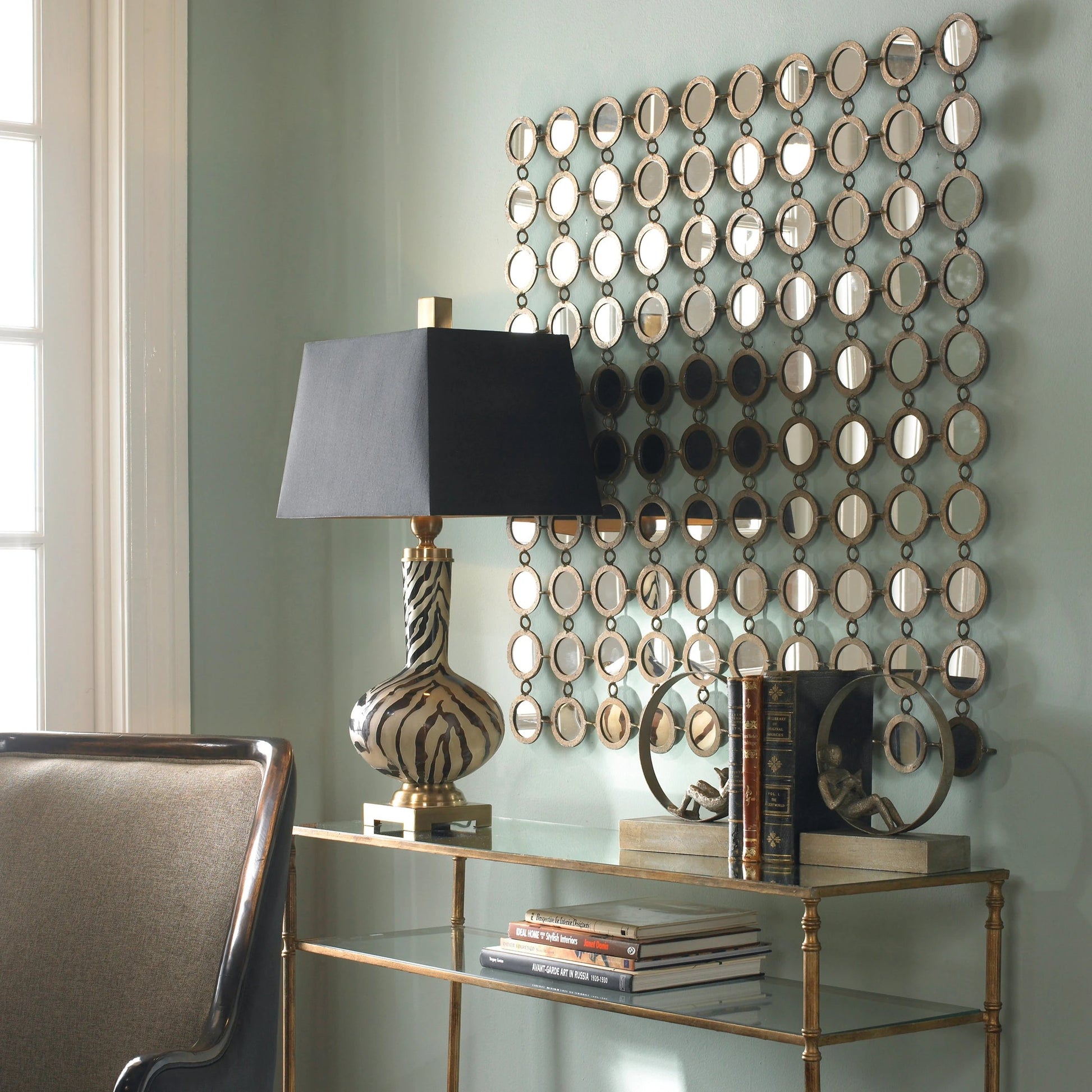 Dinuba Champagne Mirror by Uttermost in silver. Made from metal in a modern style.