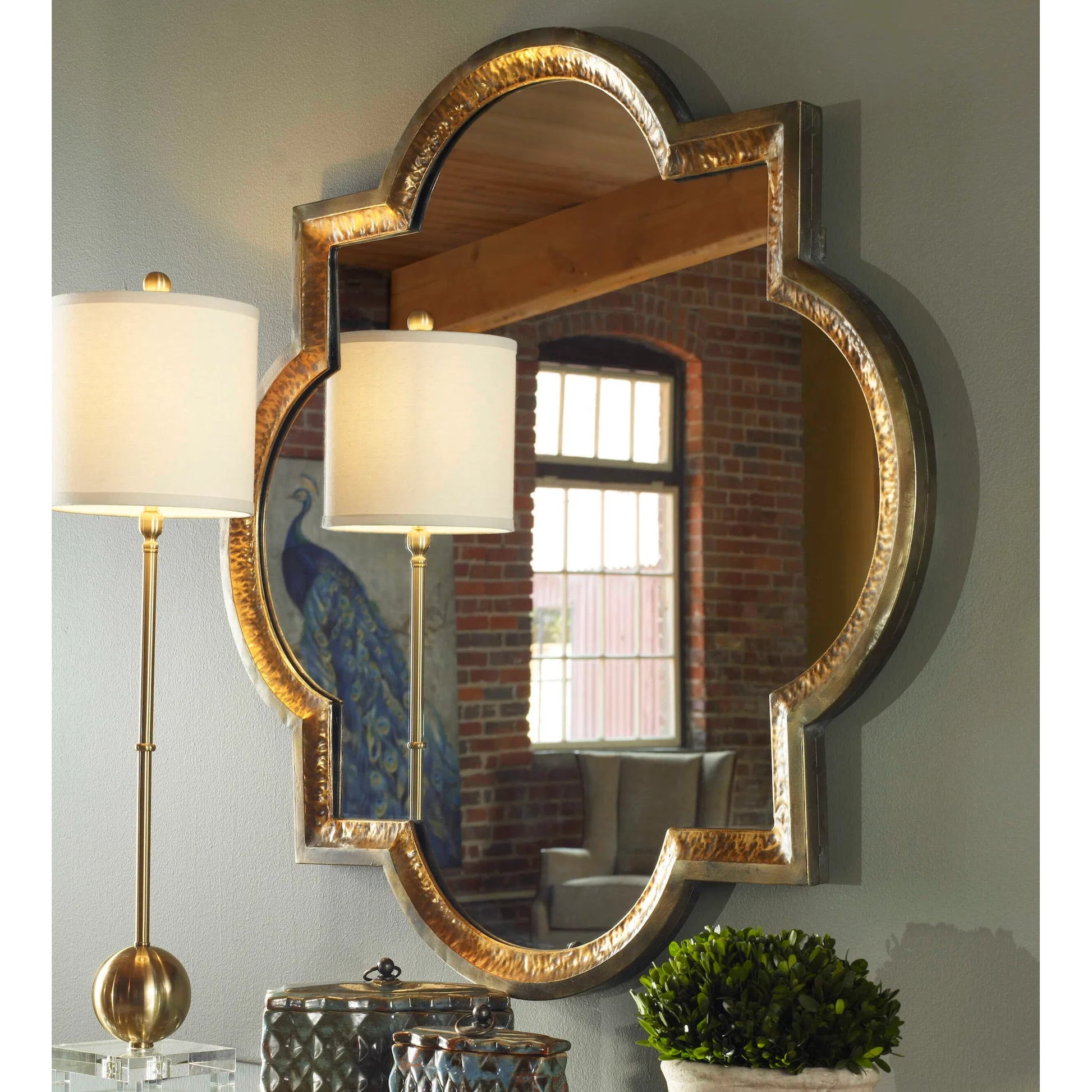 Lourosa  Mirror by Uttermost in gold. Made from metal in a traditional style.