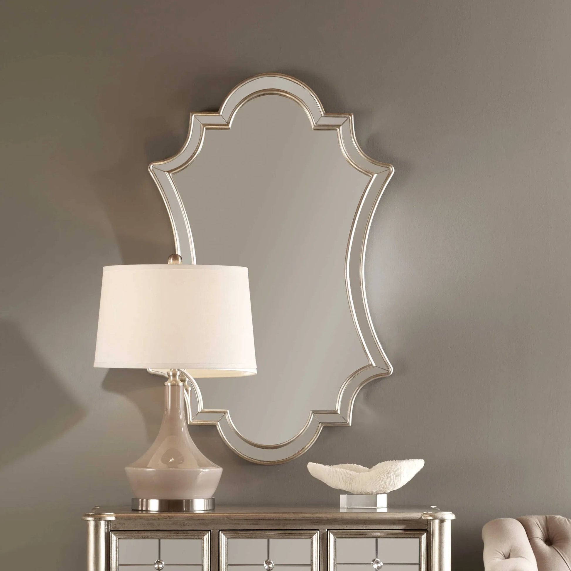 Elara Wall Mirror by Uttermost in silver. Made from pu leather, mdf, glass in a transitional style.