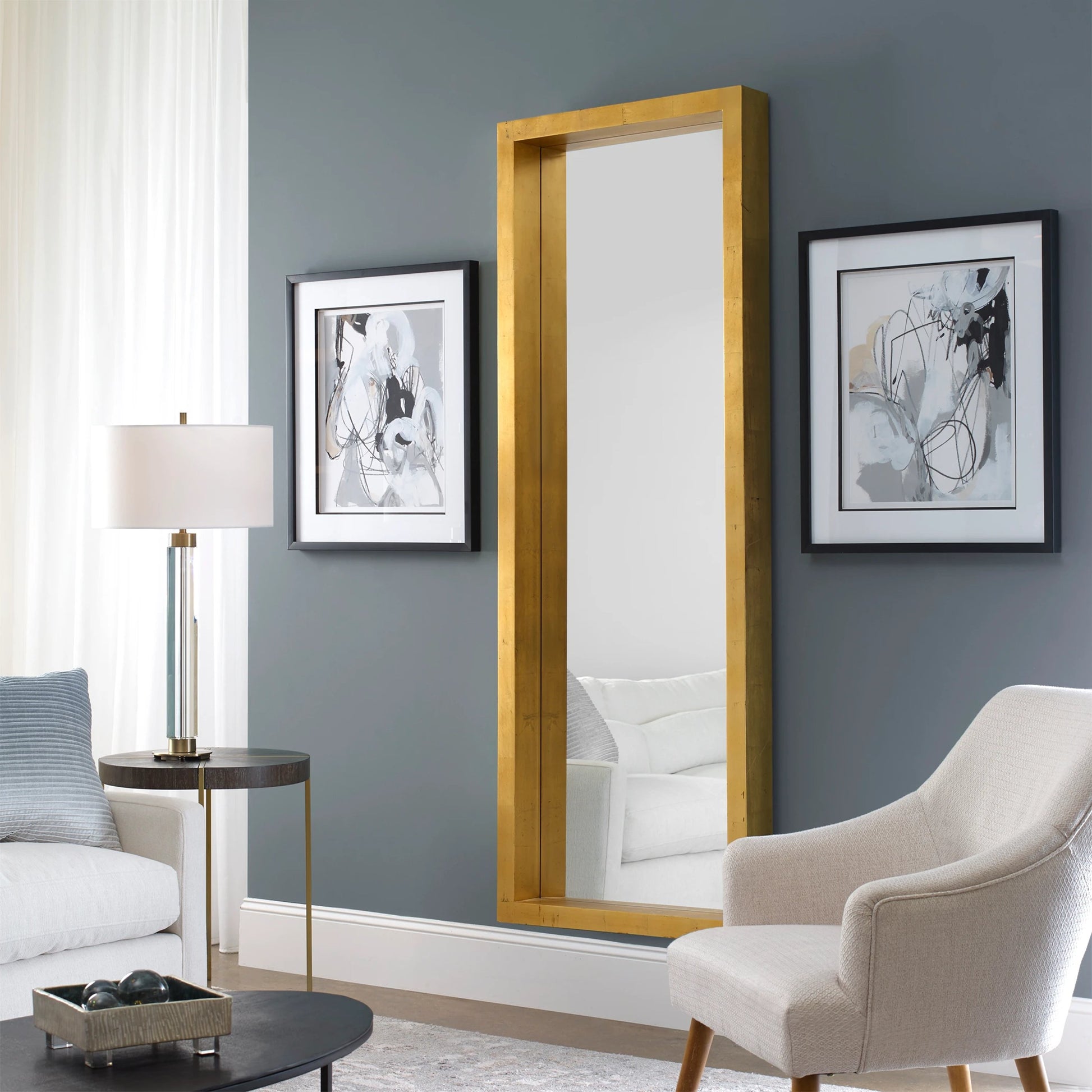 Edmonton Gold Leaner Mirror by Uttermost in gold. Made from pine in a modern style.