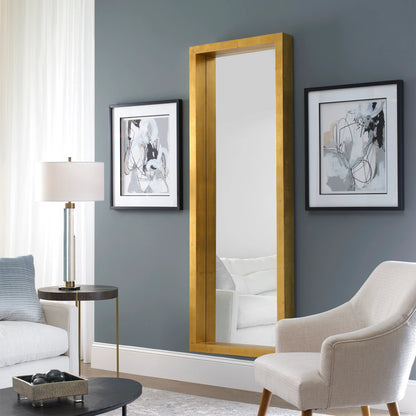 Edmonton Gold Leaner Mirror by Uttermost in gold. Made from pine in a modern style.