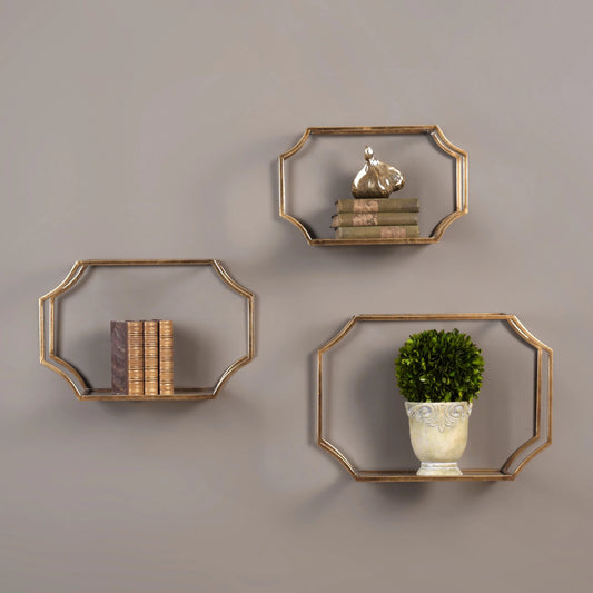 Lindee Wall Shelves (Set of 3) by Uttermost in gold. Made from metal, glass in a transitional style.