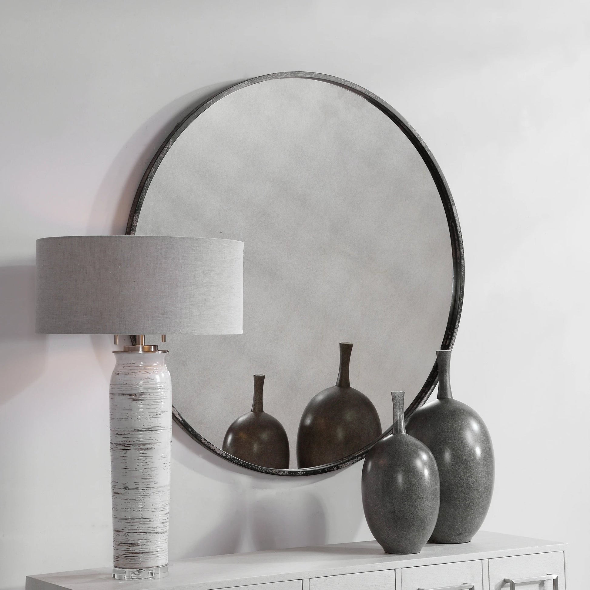 Argand Industrial Round Mirror by Uttermost. Made from metal, mdf, glass in a modern style.