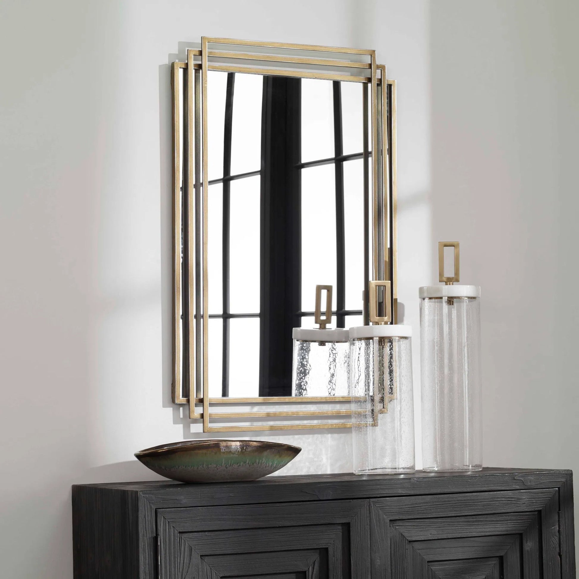 Amherst Brushed Mirror by Uttermost in gold. Made from iron, mdf, mirror in a transitional style.