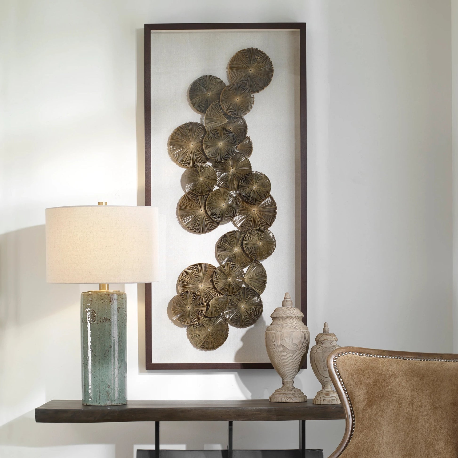 The Times by Uttermost in multi. Made from pine, paper, glass, linen, velvet in a coastal style.
