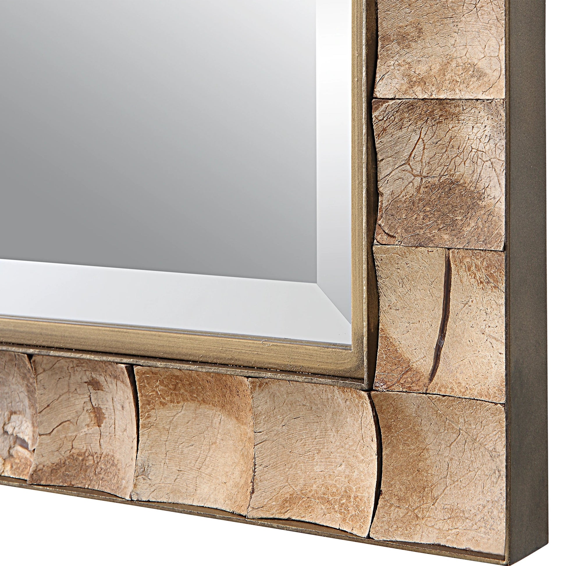 Cocos Mirror by Uttermost in dark gold. Made from iron, glass coconut shell, mdf in a transitional style.